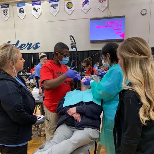 the doctor with a female staff member during a procedure