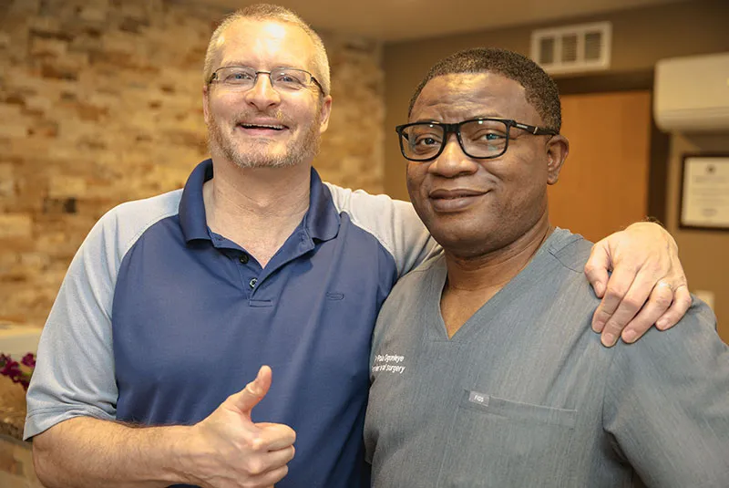 Dr. O and patient smiling.
